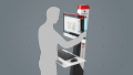 A person standing in front of the control element while using the software. The right hand is resting on the edge of the screen, the interface is operated with the thumb.