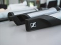Photograph of different versions of the stems with the Sennheiser logo.