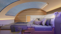 Comfortably fitted bed in a compartment based on the concept of the Refit Night Express. There is a panoramic skylight above the bed through which the starry sky is visible.